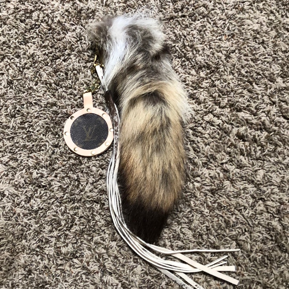 Handmade foxtail accessory for purse.